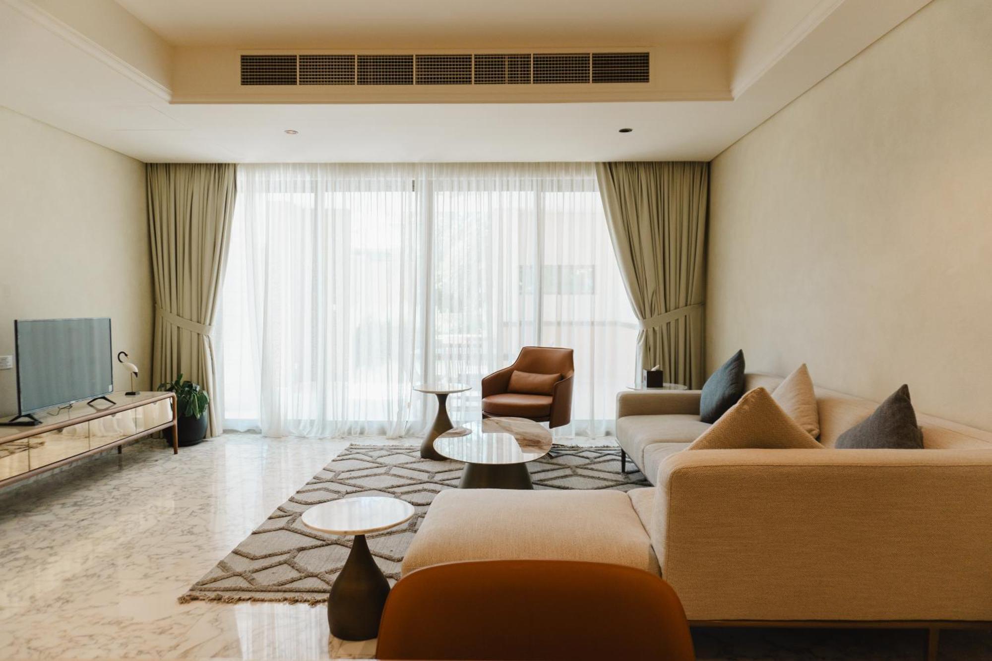 Palavra Resort Manáma Kültér fotó A living room in a condominium