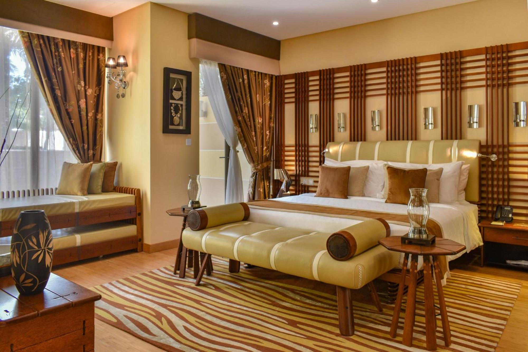 Palavra Resort Manáma Kültér fotó A bedroom at the Taj Bengal